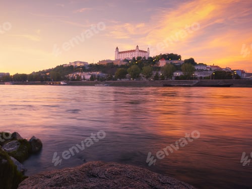 Preview: Danube river and Bratislava castle on the hill at sunset, Slovakia