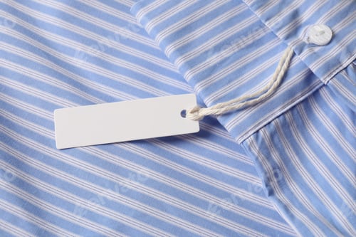 Preview: Cardboard tag on striped shirt, above view