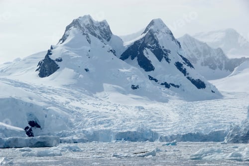 Preview: Snow Capped Mountains in Antarctica Under Cloudy Sky