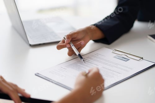 Preview: New graduate woman filling out an application form for HR department Review and review your educatio