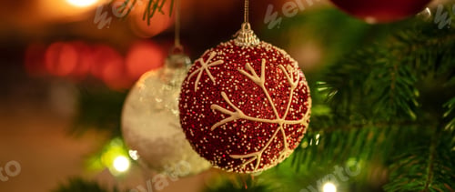 Preview: Christmas bauble hanging on a spruce, closeup view
