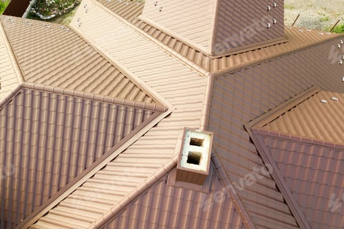 Preview: House roof surface covered with brown metal tile sheets.