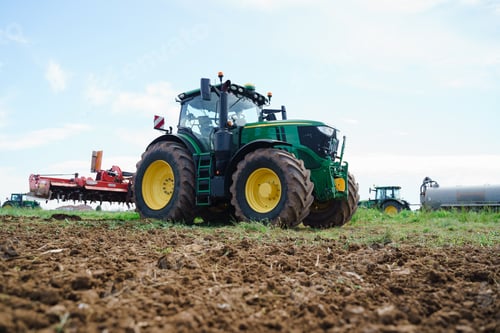 Preview: A farmer using a tractor to prepare the fields for planting. The image highlights the importance of