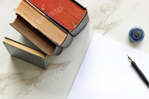 Preview: Above vintage book stack with pen and ink