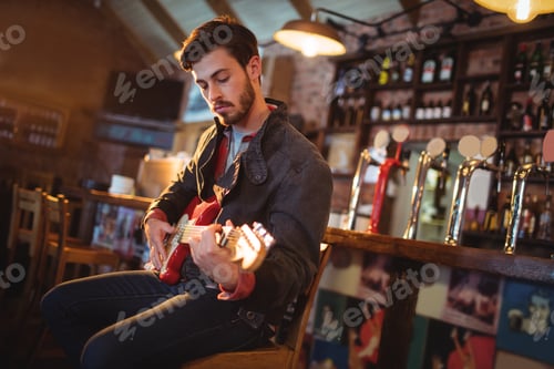 Preview: Young man playing guitar