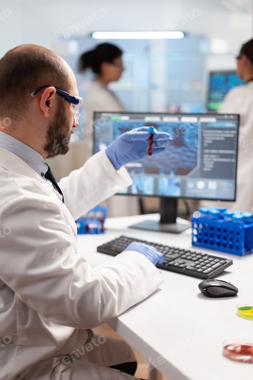Preview: Genetic scientist studying epidemics holding sample of blood
