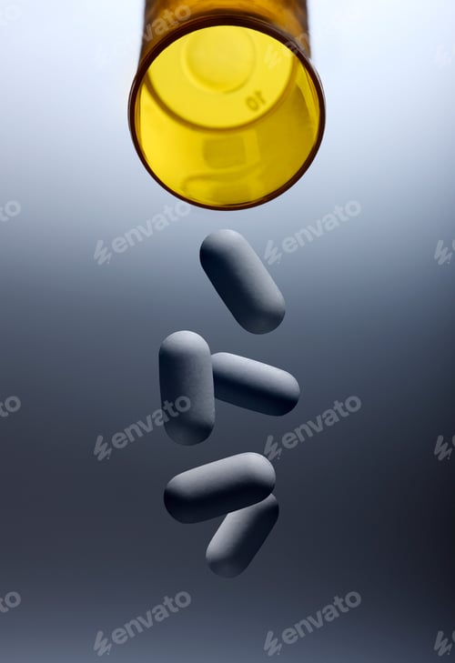 Preview: Pills pouring from prescription bottle