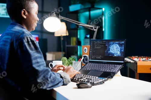 Preview: Female developer coding on laptop