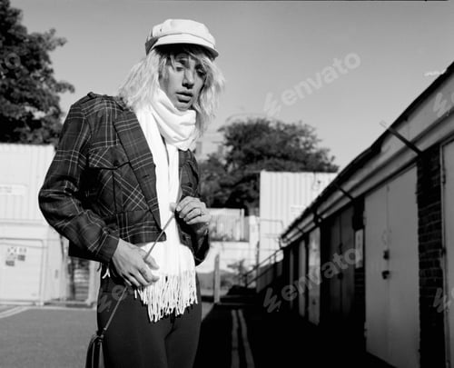 Preview: An edgy female woman is posing in London. Analog film camera.