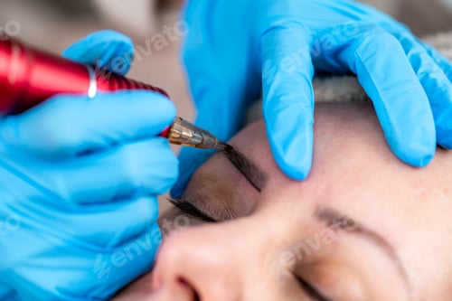 Preview: Eyebrow tattooing or microblading in a professional eyebrow salon.