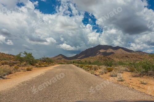 Preview: Desert road with dramatic clouds