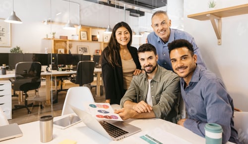 Preview: Diverse startup team collaborating in modern office setting