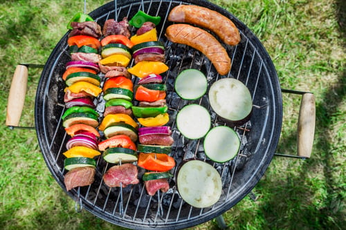 Preview: Roasting fresh vegetables and red beef with herbs in garden