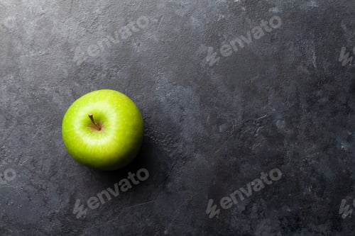 Preview: Ripe green apple fruit on dark stone table