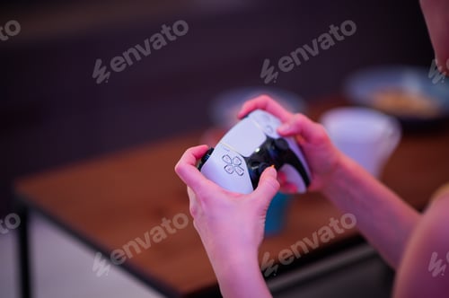 Preview: Girl with next gen controller in her hands playing games at home