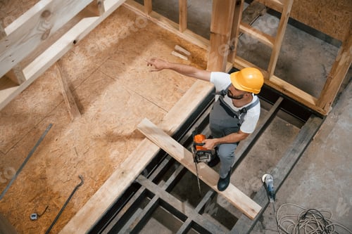 Preview: Project of wooden building. Industrial worker in warehouse