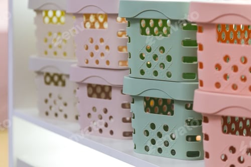 Preview: The concept of organizing home space and storing things. Plastic boxes and containers on the shelf