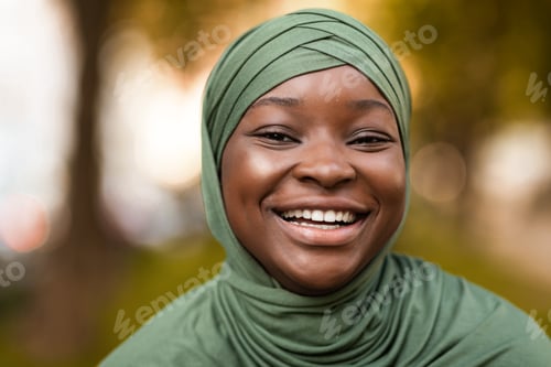 Preview: True Happiness. Portrait Of Cheerful Black Muslim Woman In Headscarf Sincerely Laughing