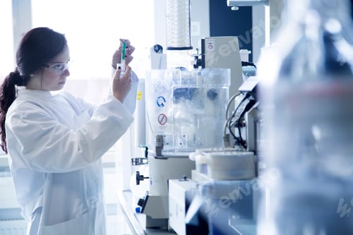 Preview: Young female scientist working in a biochemistry labroratory