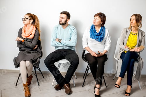 Preview: People in casual sitting in a row