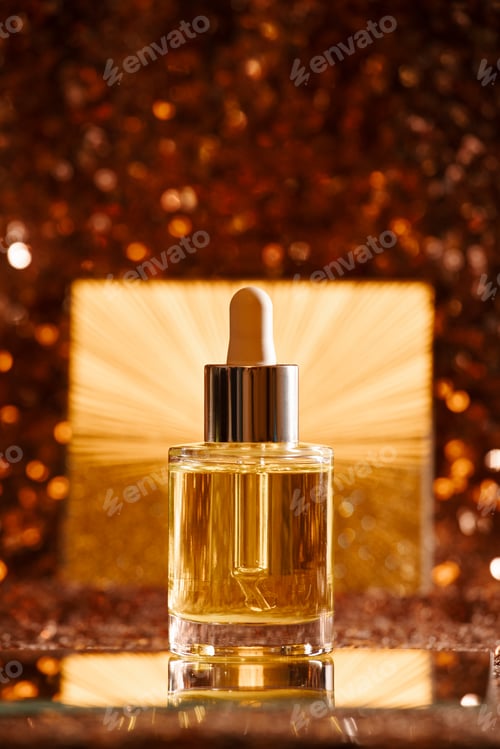 Preview: face oil on sequin dress with gold starburst backdrop
