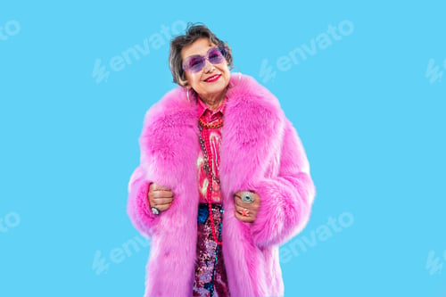 Preview: Happy and funny senior old woman on colorful background