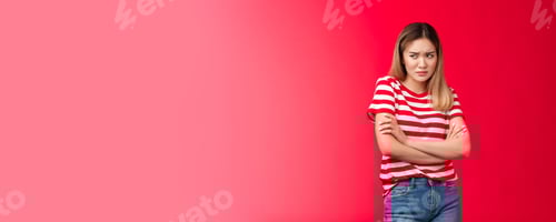 Preview: Upset timid insecure frowning asian blond girl feel offended, block insulted, cross arms chest