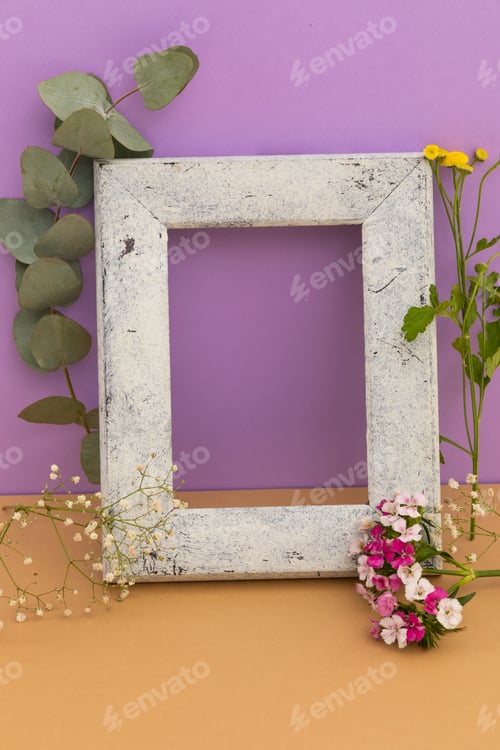 Preview: Rustic wooden frame with flowers and plants on purple and orange background