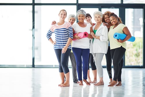 Preview: Yoga is for everyone. Shot of a group of women waiting for yoga class to begin.