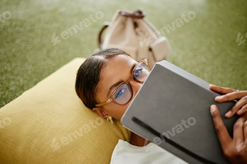 Preview: Brazilian woman, notebook or education study on university college, school campus or relax grass tu