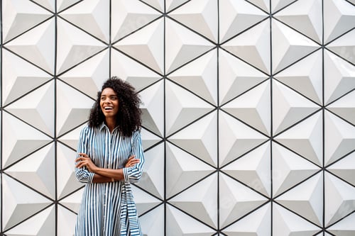 Preview: Happy pretty woman looking away smiling