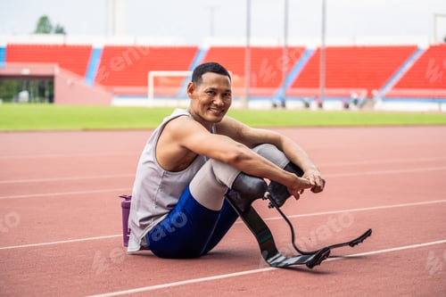 Preview: Portrait of Asian para-athletes disabled with prosthetic in stadium.