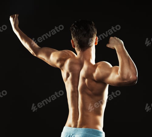 Preview: Athletic man on the black background