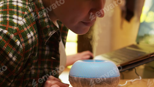 Preview: Adult woman inhale steam from air purifier