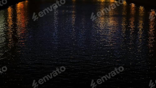 Preview: Beautiful view of city canal with evening lights. Concept. Yellow city lights illuminating the