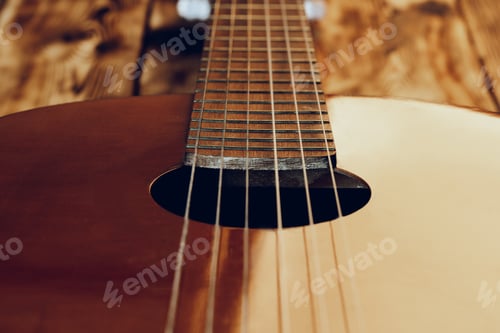 Preview: Wooden acoustic guitar body and fingerboard close up