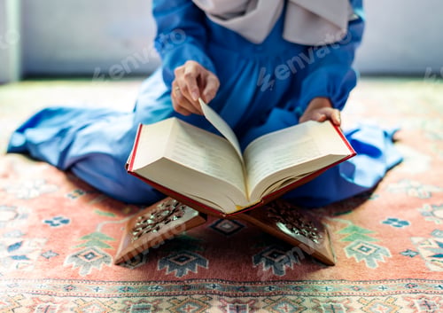 Preview: Muslim woman reading from the quran