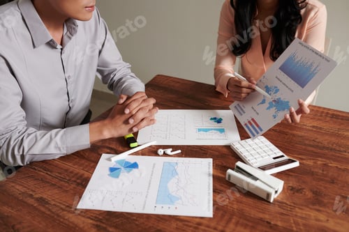 Preview: Business People Discussing Documents