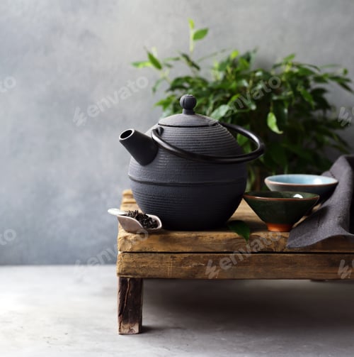 Preview: cast iron kettle on wooden table for tea ceremony