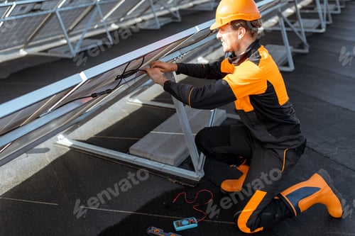 Preview: Electrician connecting solar panels