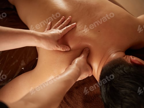 Preview: Asian man receiving back massage