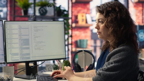 Preview: Female programmer developing app and software algorithm on pc