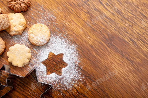 Preview: Composition of ginger man cookie cutters with christmas cookies and copy space on wooden background