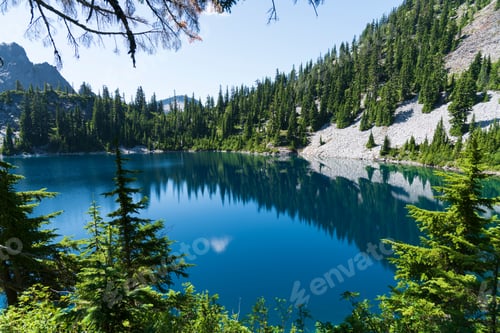 Preview: Deep blue mountain forest lake