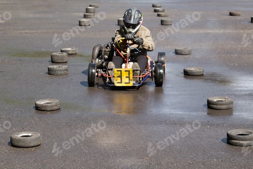 Preview: Karting - driver in helmet on kart circuit