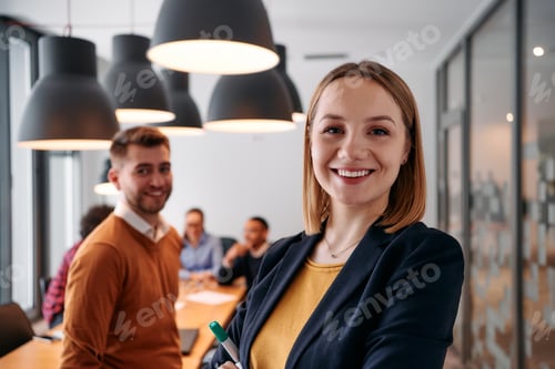 Preview: Confident Blonde Businesswoman Leading Team in Modern Office Setting.