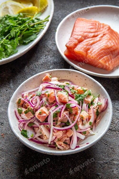 Preview: Chilean salmon ceviche. Fresh raw salmon marinaded with purple onion, coriander in lemon juice.
