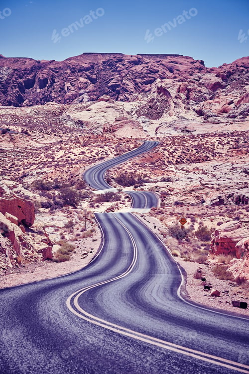Preview: Vintage toned picture of a winding desert road.