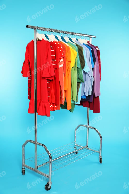 Preview: Wardrobe rack with different bright clothes on color background
