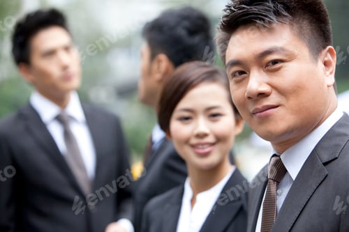 Preview: Adroit businessman with his team in Hong Kong